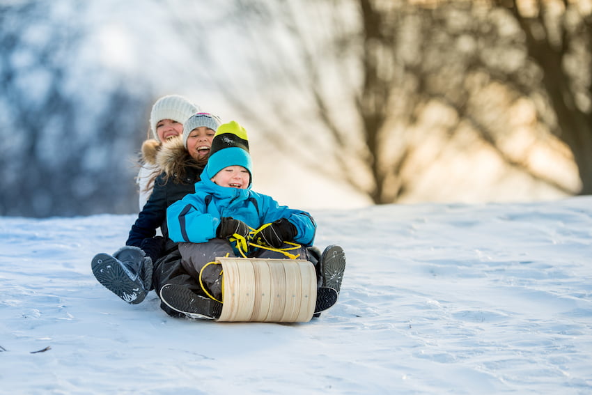 Kids having fun on the tobbogan hill
